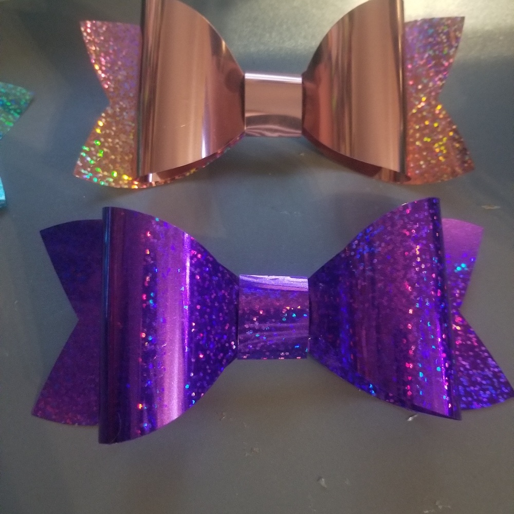 Bundle of 8 big cheer bows on hair ties.